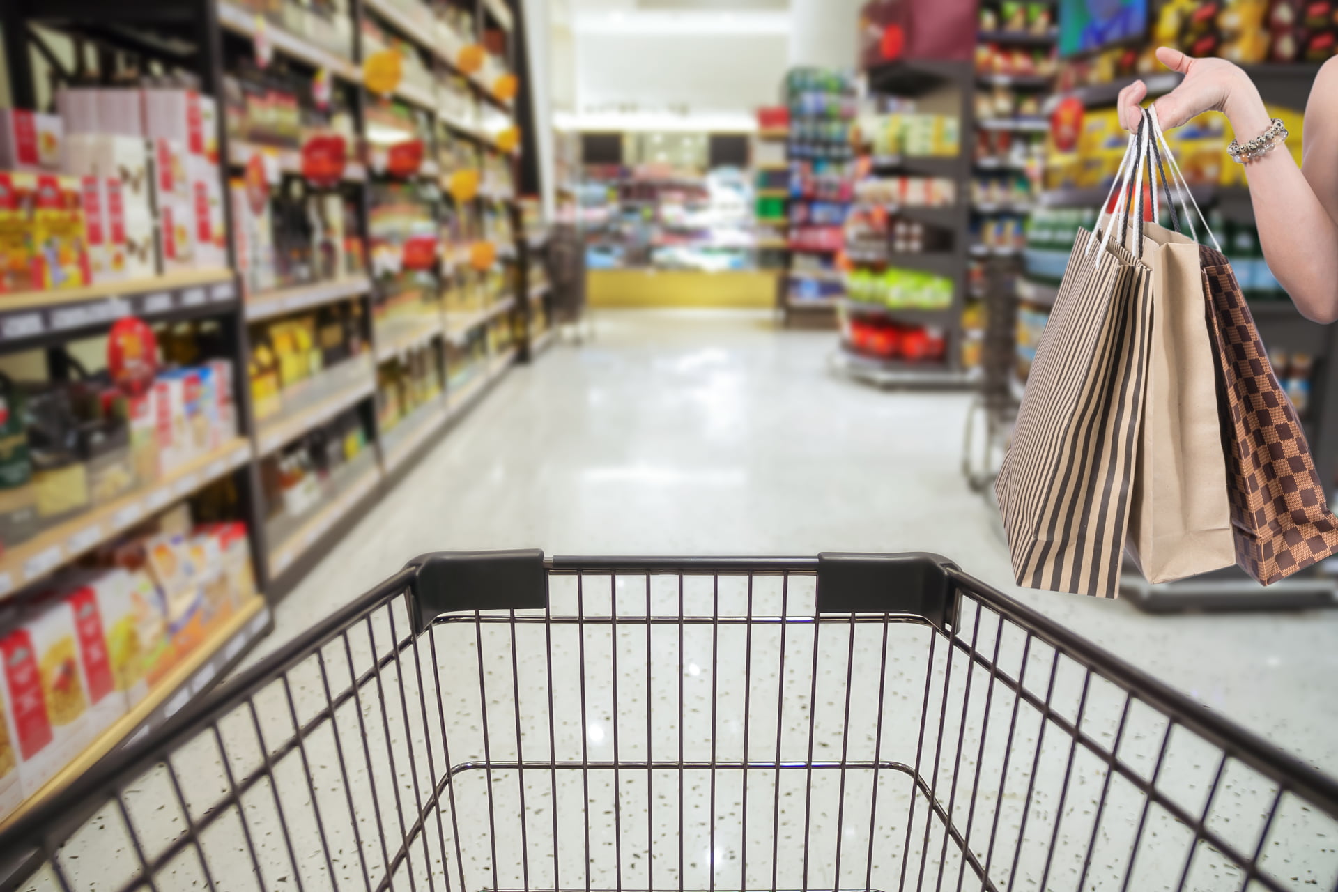 holding-shoping-bags-by-hand-on-supermarket-with-a-2021-07-26-17-51-15-utc.jpg